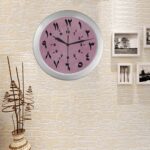 wall clock numbers arabic numerals pink background display